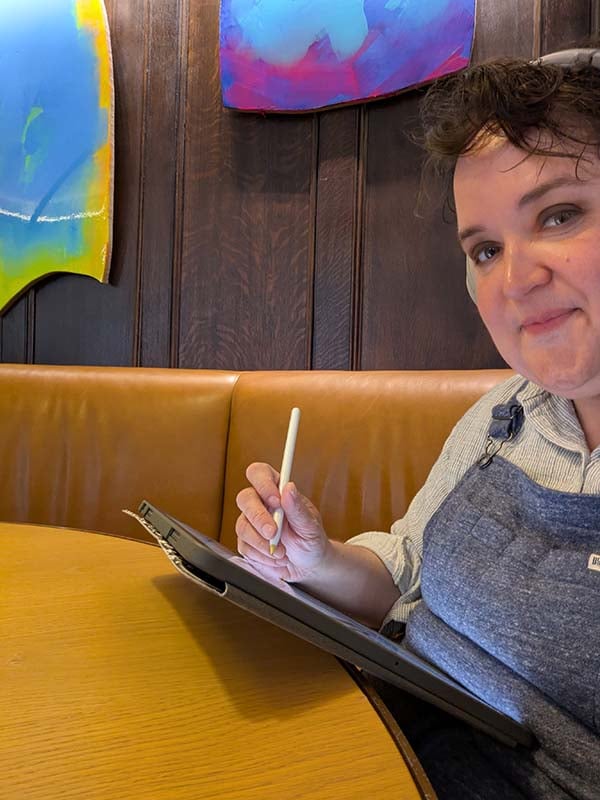 Me working on the DBT activity book in a cafe.