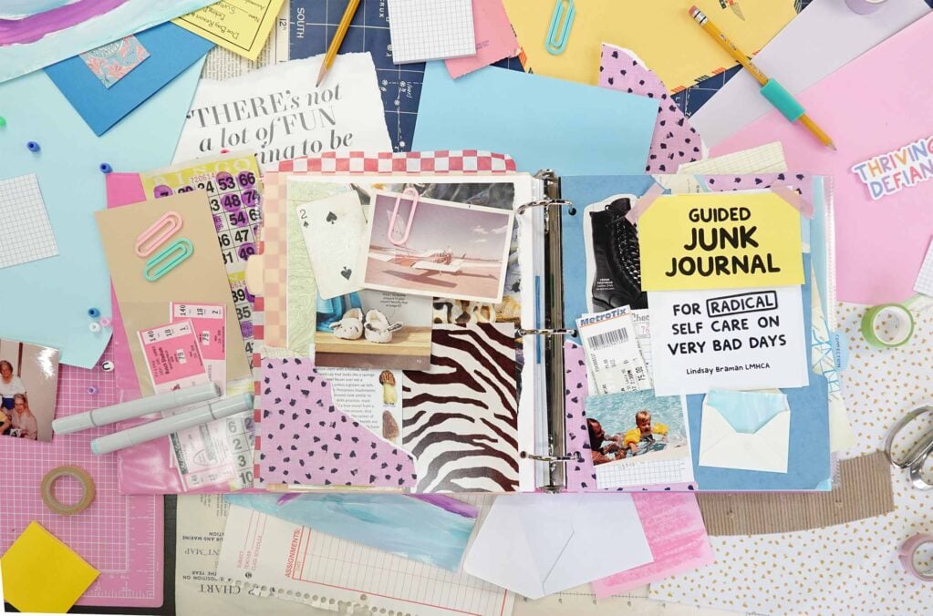 A jounk journal setup laid out on a desktop with cover open